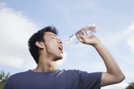 Young Man Drinking Water