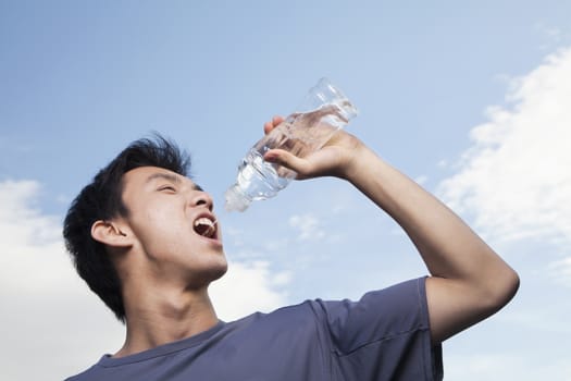 Young Man Drinking Water