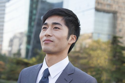 Young Businessman  Looking away