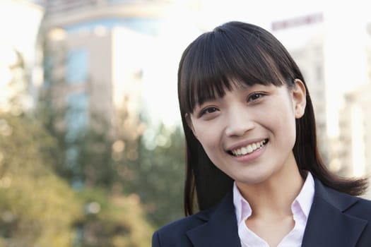 Young Businesswoman  Looking at Camera