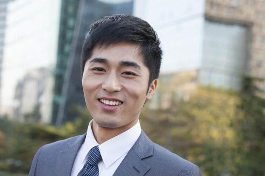 Young Businessman  Looking at Camera