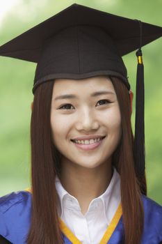 Young Woman Graduating From University, Looking-Up Horizontal Portrait