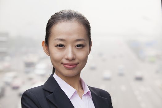 Young Businesswoman  Looking at Camera