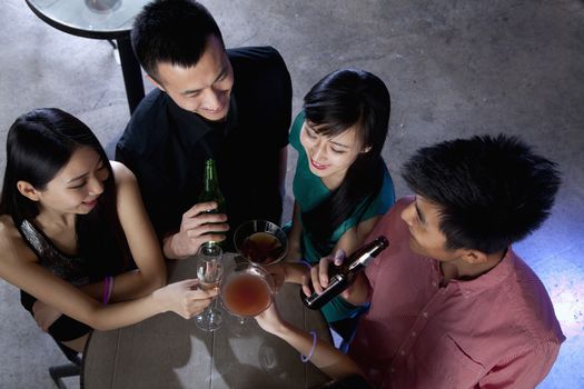 A group of friends having drinks in nightclub