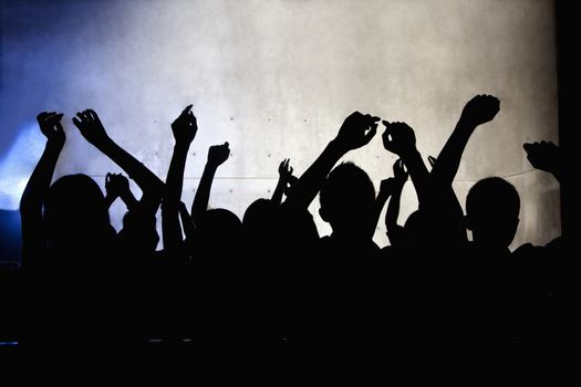 A crowd of young people dancing in a nightclub