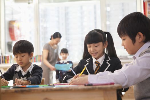 School children drawing during art class, Beijing 