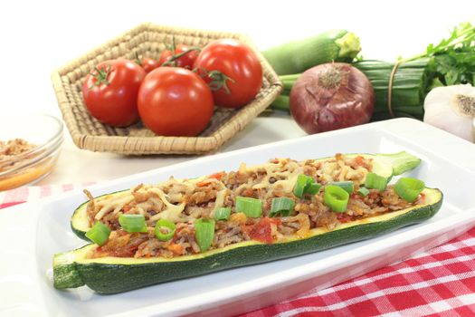 stuffed zucchini with ground beef on a light background