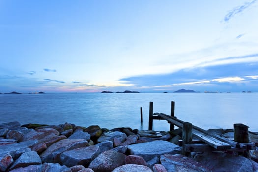 Sea stones sunset with bridge background