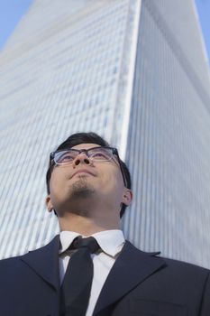 Businessman by the world trade center in Beijing, China