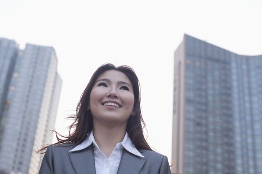 Portrait of young businesswoman outdoors, Beijing