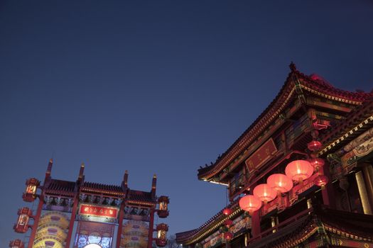Traditional Chinese buildings illuminated at night in Beijing, China