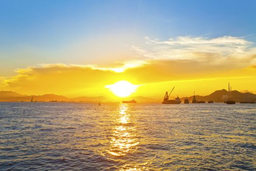 Sunset with fishing boats background