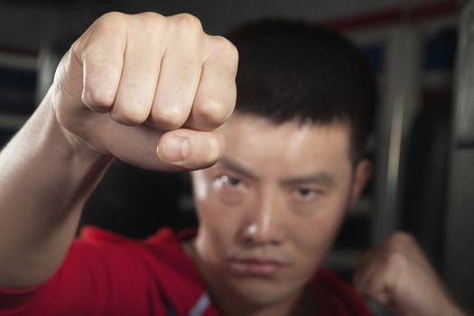 Close up of boxer throwing a punch at the camera