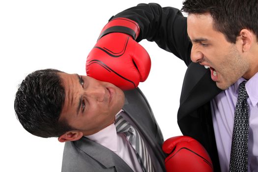 Two businessmen boxing