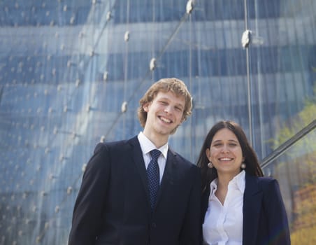 Portrait of two smiling young business people outdoors in Beijing, China