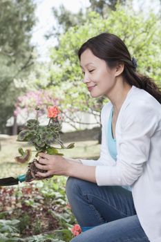 Woman planting flowers.