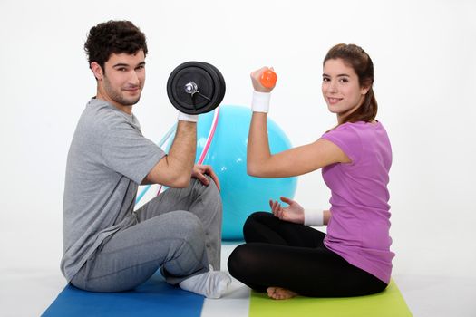 Couple lifting weights