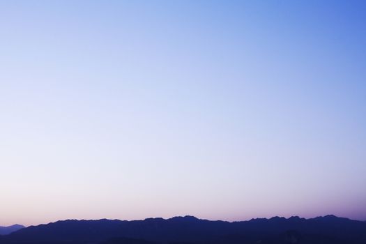 Landscape of mountain range and the sky at dusk, China