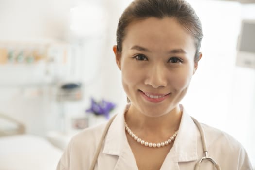 Portrait of smiling young female doctor in a hospital 