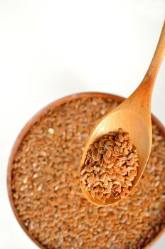 flax seeds shoot on wood, white background