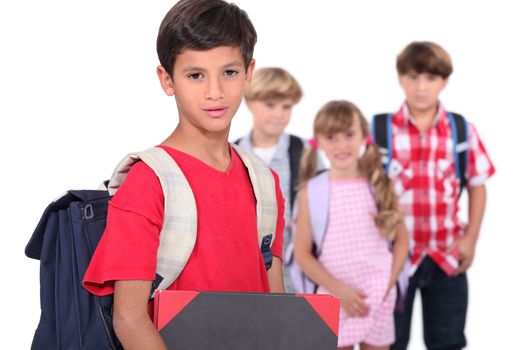 Four young schoolchildren