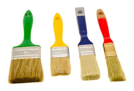 colorful different size paint brushes isolated on white background.