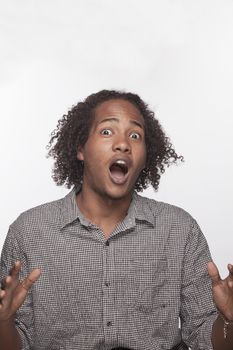 Portrait of shocked and surprised young man