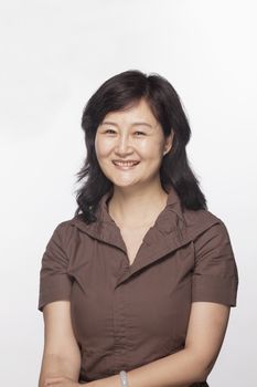 Portrait of smiling woman, studio shot