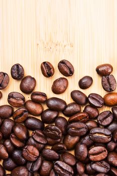 The image is laid out coffee beans on the background of the old board