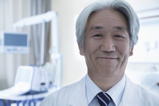 Close-up portrait of mature male doctor in the hospital