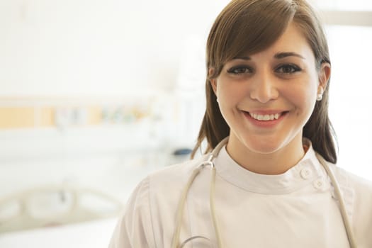 Portrait of smiling young female doctor in a hospital 