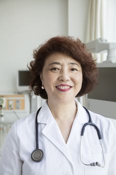 Portrait of smiling female doctor with a stethoscope looking at camera