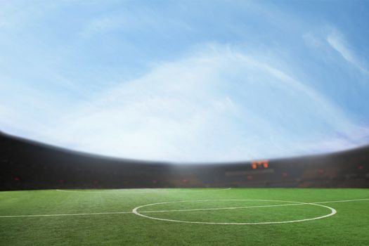 Digital composit of soccer field and blue sky