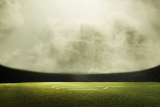 Digital composit of soccer field and cloudy sky