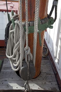 Sailboat wooden marine rigs and ropes. Nautical traditional tackle 