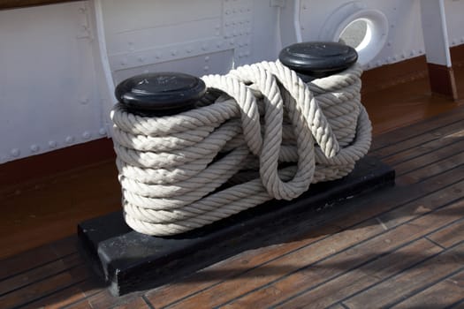 Sailboat wooden marine rigs and ropes. Nautical traditional tackle 