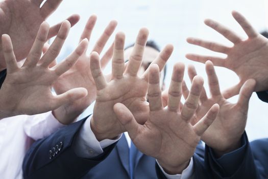 Close-up of four business people's hands