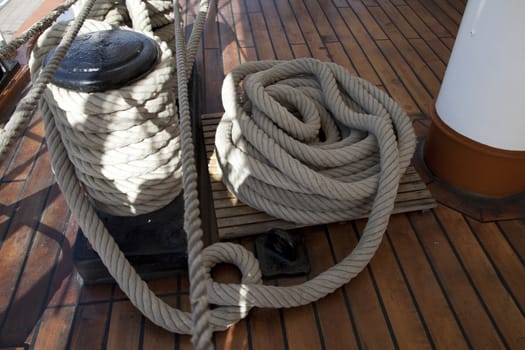 Sailboat wooden marine rigs and ropes. Nautical traditional tackle 