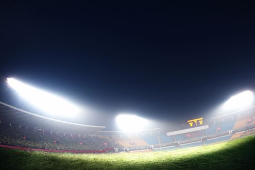 Digital composit of soccer field and night sky