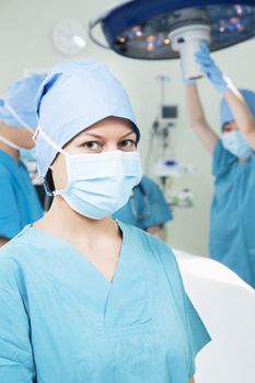 Portrait of female surgeon wearing surgical mask in the operating room, 