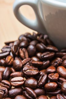 The image is laid out coffee beans on the background of the old board