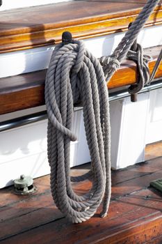 Sailboat wooden marine rigs and ropes. Nautical traditional tackle 