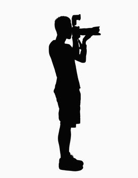 Silhouette of man holding camera.