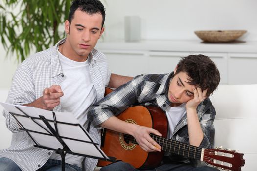 teenager having music lesson