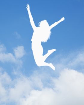 Silhouette of young woman jumping and cheering, arms in the air