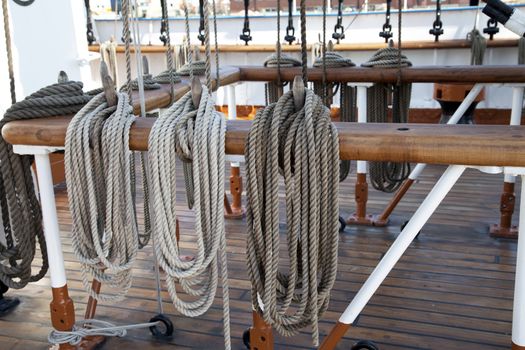 Sailboat wooden marine rigs and ropes. Nautical traditional tackle 