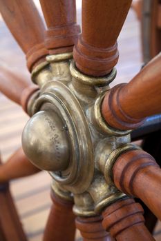 Old wooden steering wheel of the ship 
