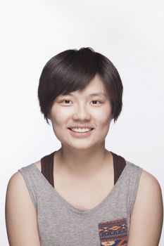 Portrait of young woman with short hair, studio shot