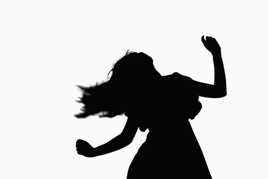 Silhouette of woman dancing.