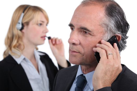 Businesspeople making phone calls
